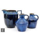 A large Bourne Denby Danesby Ware jug decorated in an all over electric blue dribble glaze,