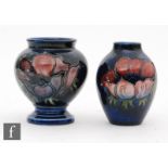 Two small Moorcroft vases of varying form, both decorated in the Anemone pattern, both with