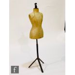 An early 20th Century shop display mannequin on an iron tripod base, stamped R.D. Franks Ltd, Market