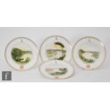 A set of four 19th Century Copeland armorial cabinet plates each amateur decorated with rural