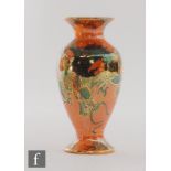 A 1920s Bursley Ware vase decorated in the Dragon pattern designed by Frederick Rhead, printed