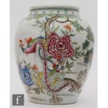 A Chinese famille rose vase, of rounded ovoid form, decorated with long-tailed birds, rockwork and
