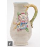 A Clarice Cliff My Garden shape 716 flower jug decorated with hand painted moulded flowers,