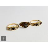 Two early 20th Century stones set five stone rings, each with missing stones, total weight 2.7g with