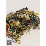 A large parcel lot of assorted modern costume jewellery to include beads, bangles, bracelets,