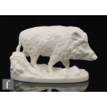 A 20th Century Nymphenburg blanc de chine model of a boar stood upon a naturalistic base, model 523,