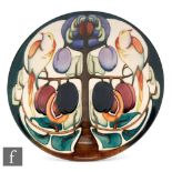 A large Moorcroft Pottery dish form trial plaque decorated with two birds sat to the boughs of a