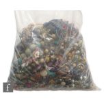 A large parcel lot of assorted modern costume jewellery to include beads, bangles, bracelets,