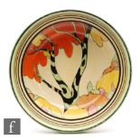 A Clarice Cliff shape 357 three footed bowl circa 1933, hand painted i the Honolulu pattern with a