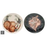 Two Moorcroft Pottery wall Year plates, the first for 1995 and decorated with a squirrel, the second
