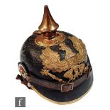 A German World War One leather pickelhaube with brass spike and eagle Baden plate, original