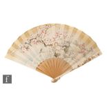 A late 19th Century Japanese Meiji era lady's fan with bamboo and ivory sticks, with Shibayama