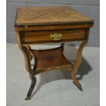 A late 19th to early 20th Century envelope top card table, with foliate inlaid ivory and satinwood