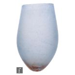 A large contemporary studio glass vase of compressed ovoid form raised to a small base, decorated