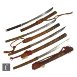 Four Dha Burmese swords with whipped handles and wooden scabbards. (4)