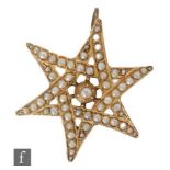 A 9ct hallmarked rose gold seed pearl pendant modelled as a star, width 3cm, weight 3g, Chester