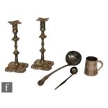 A pair of silver plated candlesticks, a plated King's pattern ladle, a small plated tankard, tea