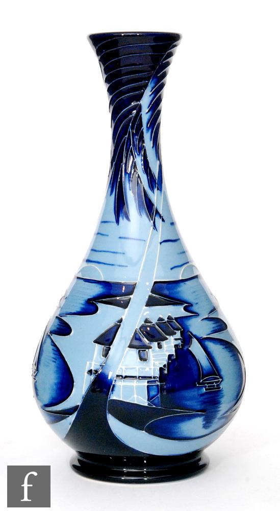 A Moorcroft Pottery bottle vase decorated in the Blue Lagoon pattern designed by Paul Hilditch,