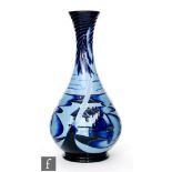 A Moorcroft Pottery bottle vase decorated in the Blue Lagoon pattern designed by Paul Hilditch,