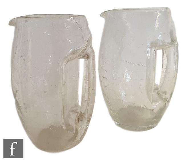 A barrel form jug with integral handle and a crackle glass finish after Kolomon Moser for Loetz,