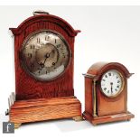 An Edwardian oak cased mantle clock with eight day striking movement stamped and numbered, with