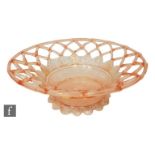 An early 20th Century Italian Venetian glass bowl, the shallow wrythen moulded bowl in pink with