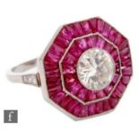 A platinum ruby and diamond cluster ring central millgrain set brilliant cut diamond weight