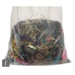 A large parcel lot of assorted modern costume jewellery to include beads, bangles, bracelets,