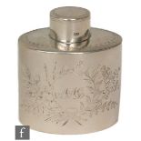 A Victorian hallmarked silver tea caddy with part engraved floral spray below pull cap, height