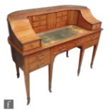 An Edwardian mahogany and satinwood crossbanded Carlton House desk by Maple & Co Limited, the