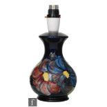 A Moorcroft table lamp decorated in the Clematis pattern, impressed mark, height 16cm, excluding