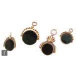Four early 20th Century 9ct bloodstone and carnelian swivel fobs, three circular and one oval