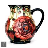 A Moorcroft Pottery Connoisseur Collection jug decorated in the Eustoma pattern designed by Carole