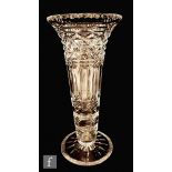 An early 20th Century John Walsh Walsh clear crystal vase of footed tapered sleeve form with