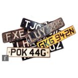 A collection of early and later vehicle license plates to include LUY285, FXE 671, FON181 and