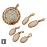 Five 9ct hallmarked single stone oval, collar set opal pendants, longest stones approx 12mm, with