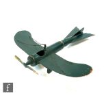 An early 20th Century trench art model of a propellor plane with bullet casing fuselage, with a