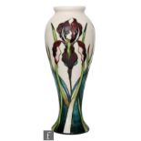 A Moorcroft Pottery vase of slender baluster form decorated in the Antheia pattern designed by