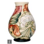 A Moorcroft Pottery limited edition vase of footed ovoid form with flared collar neck, decorated
