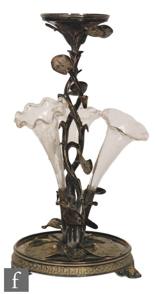 An early 20th Century silver plated epergne modelled as a lily plant to a circular base supporting