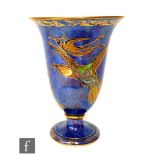 A 1930s Wedgwood Lustre vase of footed bell form, decorated in the Hummingbird pattern with enameled