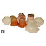 A collection of eight late 19th to early 20th Century oil lamp shades of various forms, to include