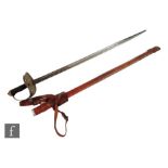 A George V artillery officer's sword and leather scabbard with pierced hilt and ray skin grip.