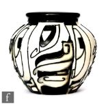 A small Moorcroft Pottery vase decorated in the Domino pattern designed by Emma Bossons, impressed