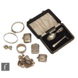 Three hallmarked silver vesta cases with engraved foliate decoration, one with engraved initials,
