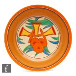 A Clarice Cliff circular plate circa 1932, hand painted in the Bobbins pattern with stylised