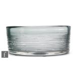 A post war glass bowl by Bengt Edenfalk for Skruf of high sided circular form in a smoke grey tint