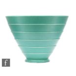 A Keith Murray Wedgwood conical bowl of footed form with stepped horizontal bands, the whole
