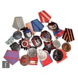 Fourteen Russian and CCCP assorted medals and badges to included an Order of Labour Glory, Order