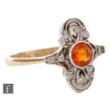 An 18ct hallmarked Edwardian style fire opal and diamond dress ring, central collar set opal to a